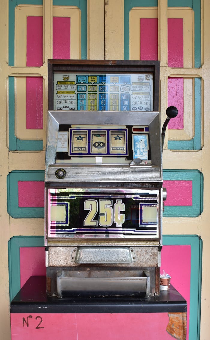 Colorful vintage slot machine featuring 25 cent plays, evokes nostalgic gambling era.